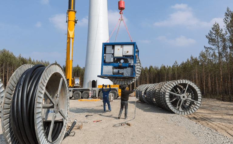 Wind turbine construction site with cable spools